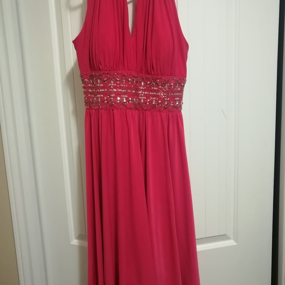 A hot pink, mid length halter top dress - Picture 1 of 3